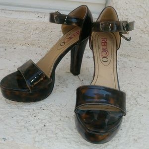 Pair of faux leather cheeta print shoes
